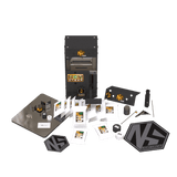 Nugsmasher Touch 12-ton rosin press essentials bundle with extraction bags, tools, and accessories on a dark green background.