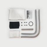 Overhead view of CenturionPro Tabletop Trimmer Parts Kit: silver hose, white & black cloths, small hardware.