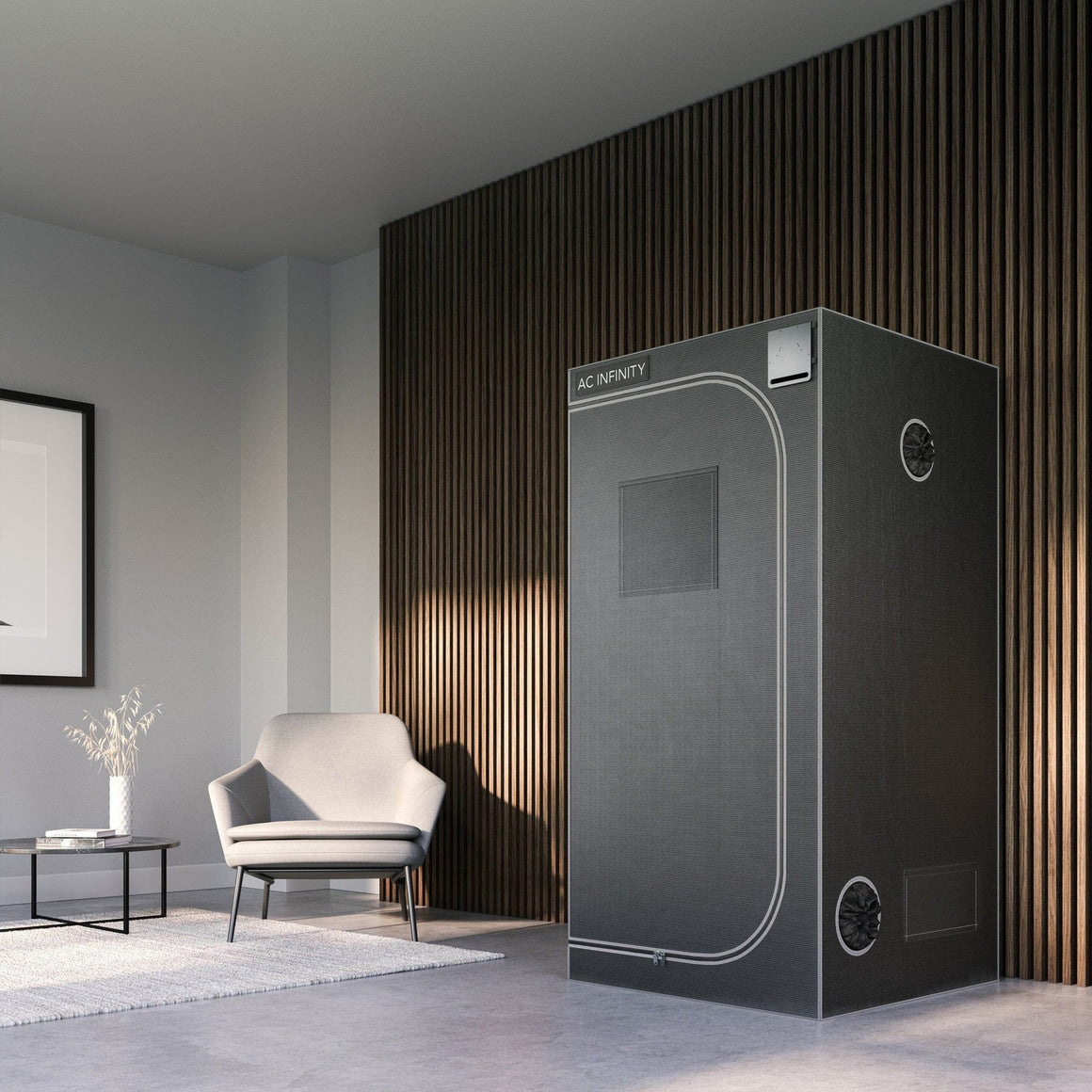 AC Infinity CloudLab grow tent in a modern room with a chair and table.