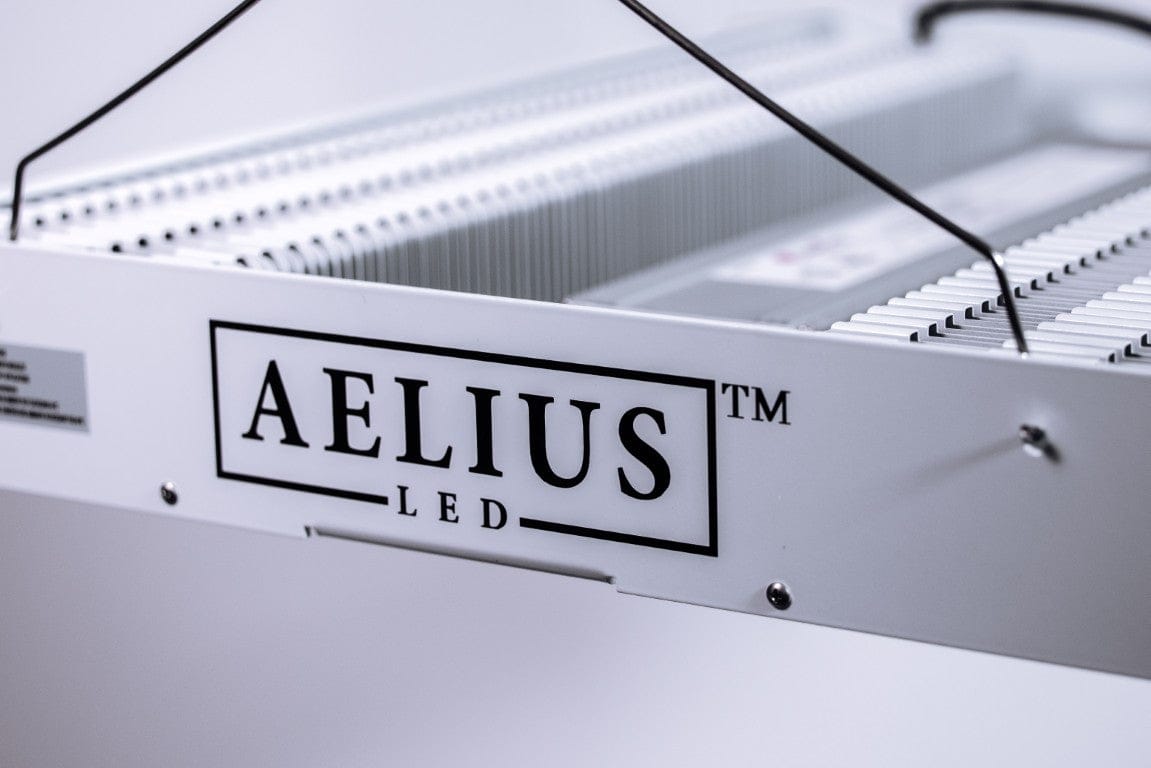 Aelius LED grow light, full spectrum, white casing, close-up on logo.