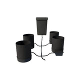 Black Autopot Flexipot XL 4-pot hydroponic grow system with central reservoir and connected grow pots.