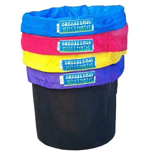 Stack of 4 colorful Bubble Bags (blue, pink, yellow, purple) 5-gallon filter bags in a black bucket.