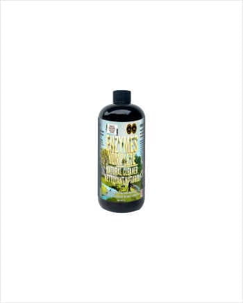 Enzymes Komplete natural enzymatic cleaner bottle with nature scene label.