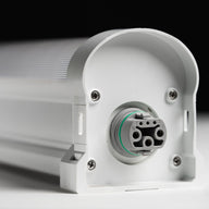 Close-up of a white LED light fixture's connector with 