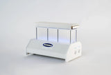 Futurola Knockbox Pro cone filling machine with clear tubes and blue LED lighting.