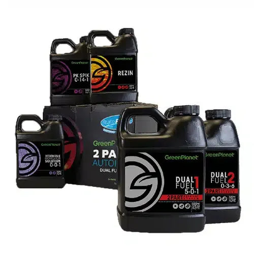 Green Planet Nutrients kit with multiple black bottles and a cardboard box, featuring logos and product names like "REZN" and "DUAL FUEL".
