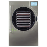 Stainless steel Harvest Right commercial freeze dryer with circular door, multiple trays inside, and digital display.
