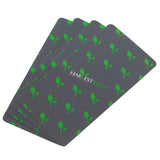 Stack of four grey Harvest Right silicone mats with green leaf pattern and logo, designed for freeze dryers.