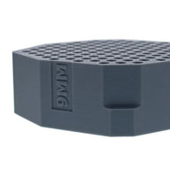 Gray 9MM cartridge holder with honeycomb-like top surface.