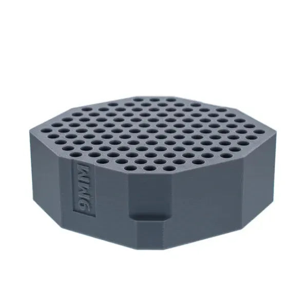 Grey 9mm cartridge holder with multiple round slots, octagonal shape.