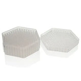 Two clear, hexagonal plastic trays with many small compartments, one stacked on top of the other.