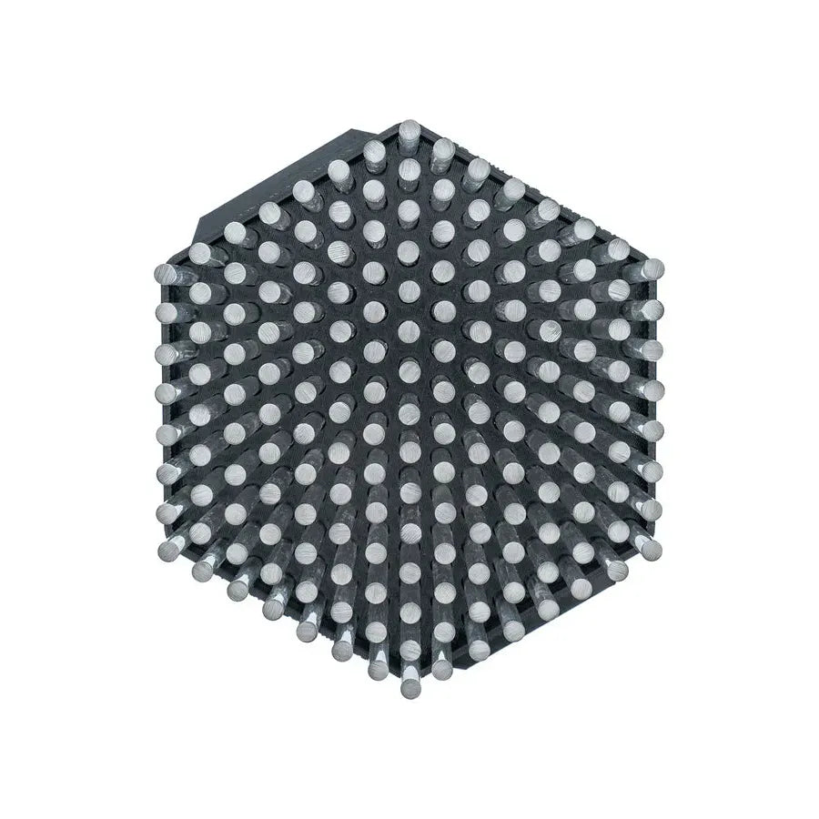 A black hexagonal tool with many silver pins sticking out.
