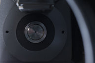Close-up of a part of a heavy-duty industrial waste shredder machine.