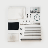 CenturionPro Original/Silver Bullet trimmer parts kit flat lay. Includes rollers, metal bars, gears, bearings, & fabric.